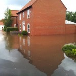 21.50 side of 34 - Trail off to right behind the house - showing now these houses flooded also from the front