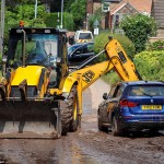 © Peter Summers / Newsteam 24/07/2013 Clear-up: A digger is brought in to clear some of the mud and dirt away after an entire street in Southwell, Nottinghamshire was submerged in water