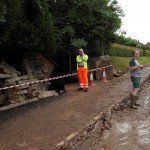 © Peter Summers / Newsteam 24/07/2013 Destruction: Workers begin to repair the damage after heavy rain caused the river to burst its banks in Southwell and flooded an entire street