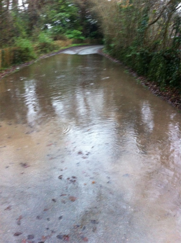 20/12/2012 Excess water pooling on Hopkiln Lane from Halam Road. If left unchecked this starts flooding into gardens and in bad conditions threatens houses. by Ben Huson