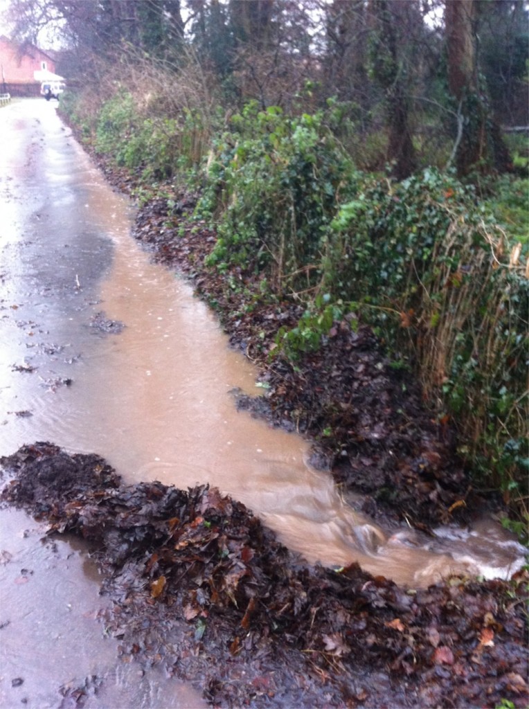 20/12/2012 Quick makeshift channel on Hopkiln Lane to funnel overflowing Halam Road water into the dyke to prevent flooding further down Hopkiln Lane by Ben Huson