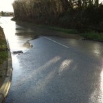 Surface water draining into gullies at bottom of Park Lane