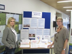 Lynn and Jacky showing information on the Library Help Desk, Education Resource Group, Street Reps.