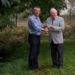 Brendan Haigh Chair of Southwell Civic Society presenting the cheque to Rob Jordan, Co-Chair of Southwell Flood Forum, alongside Potwell Dyke